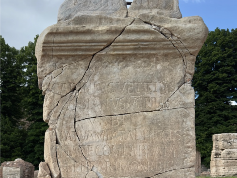 Marble base with dedication to “Gabinius Vettius Probianus” located at the entrance to the Basilica Iulia